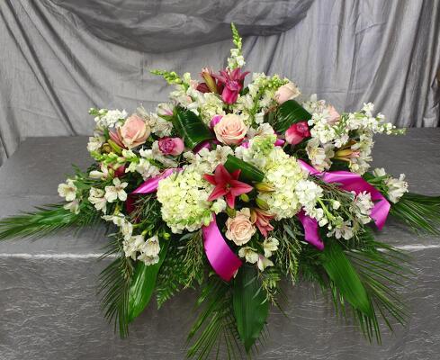Pink lilly casket spray  from Aletha's Florist in Marietta, OH