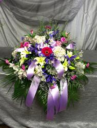 Purple casket spray  from Aletha's Florist in Marietta, OH